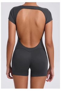 Detailed back view of backless grey yoga romper with V-shaped contour stitching