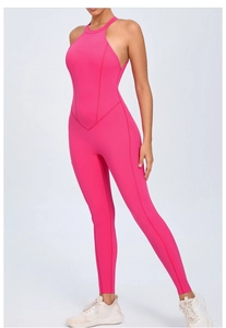 Detail of hot pink backless yoga jumpsuit featuring a halter neck and V-shaped seam design