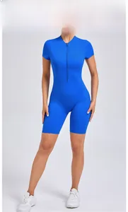 Detail view of royal blue yoga bodysuit featuring a front zipper and short sleeve design
