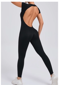 Detail showing the U-shaped back cutout and breathable fabric of the black yoga jumpsuit