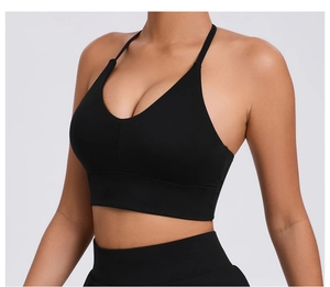 Detail of adjustable strappy back and deep V-neck on black high-stretch sports bra