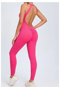 Detail of cross-back straps and scrunch butt design on hot pink yoga jumpsuit