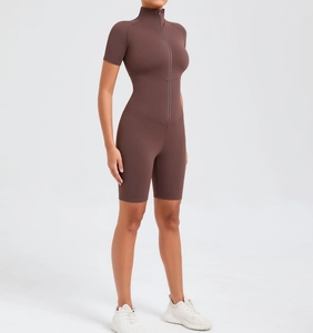 Detail of the high-stretch matte fabric and zipper closure on the brown yoga bodysuit