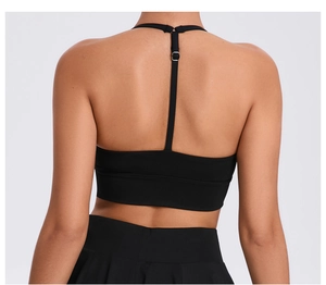 Detail view of the black sports bra racerback design with adjustable slim shoulder straps