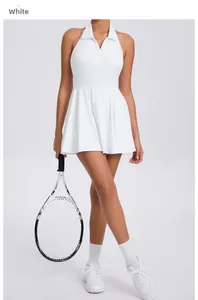 Close-up of white athletic dress with halter collar and pleated hem for tennis or golf