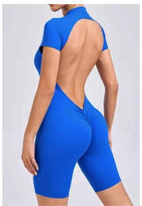 Detail of scrunch butt lifting effect and open back design on electric blue yoga romper
