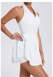 Detail view of white sports dress with built-in shorts and hidden phone pocket