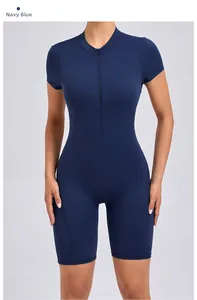 Close-up of navy blue yoga bodysuit with front zipper closure and short sleeves