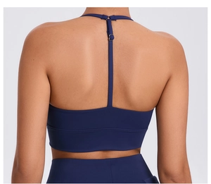 Detail of blue sports bra featuring adjustable thin straps and a racerback design