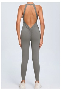 Close-up of scrunched booty detail and open back design on grey yoga bodysuit