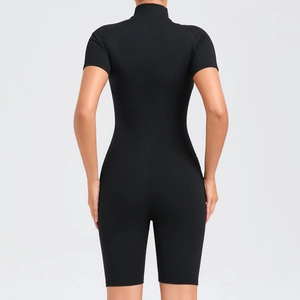 Back view of black short sleeve compression yoga bodysuit with slimming V-line seams