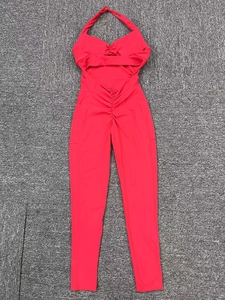 Flat lay detail of red halter neck yoga bodysuit with ruching and backless design