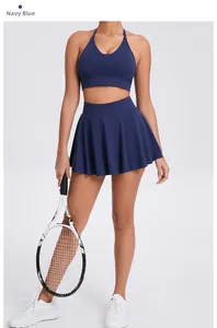Detail of navy blue V-neck sports bra and pleated tennis skirt set with high elastic fabric