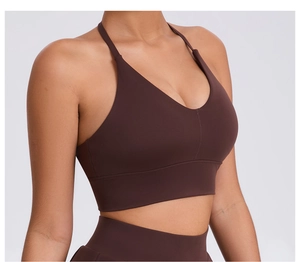 Detail view of brown yoga bra featuring deep V-neckline and wide supportive underband