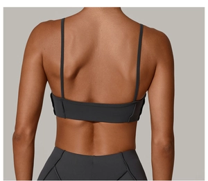 Rear view of dark grey sports set with thin straps sports bra and yoga leggings