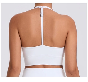 Detail view of white sports bra T-back design with high elastic fabric for yoga and fitness