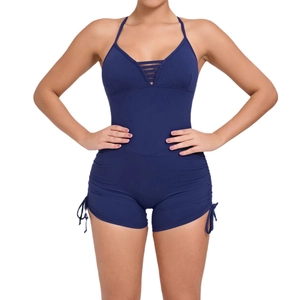 Slim fit dark blue yoga bodysuit with open back and side drawstrings for fitness