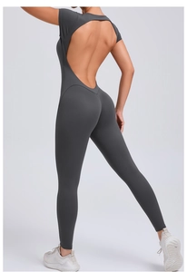 Detail of deep grey backless yoga bodysuit showing slim fit waist and hollow out back