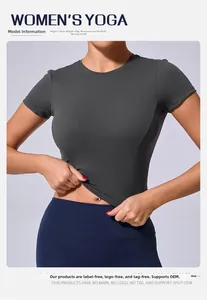Detail of slim fit charcoal yoga t-shirt showing elastic fabric stretch and fit on model