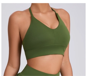 Detail view of olive green sports bra with V-neckline and wide elastic support band