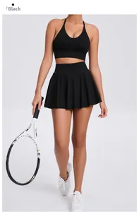 Detail of black halter neck sports bra and pleated skirt for tennis and outdoor fitness