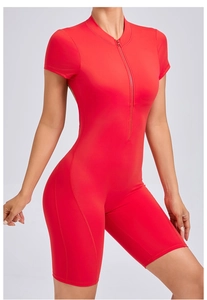 Detail of red athletic bodysuit showing half-zip neckline and reinforced stitching details