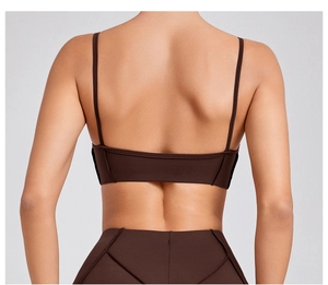 Detail view of coffee brown yoga set featuring thin straps and high-waist leggings