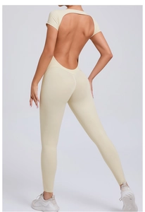 Close-up of cream yoga jumpsuit featuring a backless design and slim-fit athletic cut