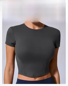 Detail view of high-elasticity dark grey crop top with curved slimming waist stitching