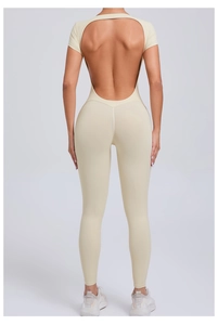 Back view of beige backless short sleeve yoga jumpsuit showing high elastic slim fit
