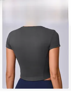 Close-up of dark grey crop top gym t-shirt featuring body-shaping vertical back seams