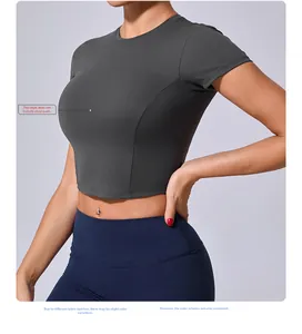 Slim fit dark grey sports crop top with crew neck and ergonomic side seams for yoga