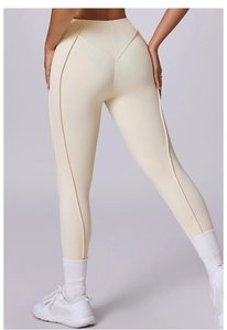 Leggings yoga beige a vita alta con cucitura a V e linee modellanti per il corpo sul retro