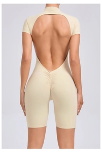 Detail view of backless beige yoga bodysuit with scrunch butt lifting design