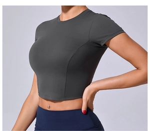 Detailed side view of fitted dark grey crop top showing ergonomic seams and stretch fabric