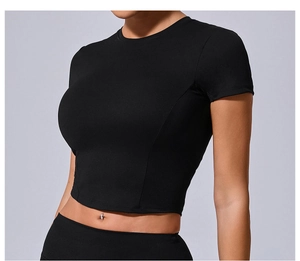 Close-up of tight-fitting black yoga crop top with ergonomic seams and quick-dry fabric