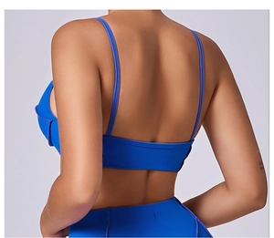 Detailed back view of cobalt blue sports vest with thin straps and open back design