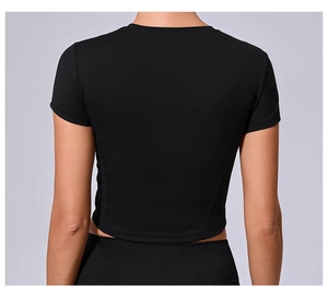 Back view of a black slim fit crop top sports t-shirt with matte finish on grey background