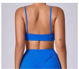 Rear view of cobalt blue sports set with thin straps and crisscross back design