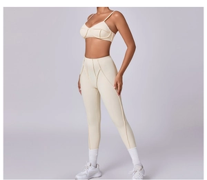 Detail of cross-back yoga bra and high-waist leggings with contour stitching