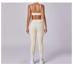 Detailed back view of beige yoga set featuring thin strap top and high-waist leggings