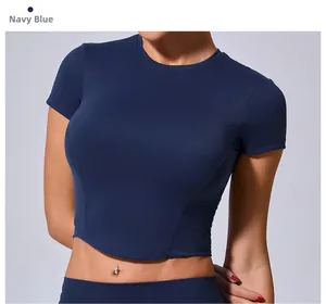 Detail of navy blue cropped gym top with structured stitching and moisture-wicking fabric