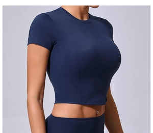 Close-up of navy blue slim-fit cropped sports t-shirt with high elasticity matte fabric