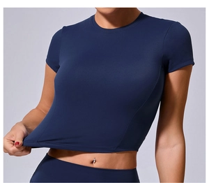 Detail view of navy blue tight yoga top showing the high elastic fabric stretch performance