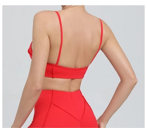 Back view of a red sports bra with thin straps and open back for yoga and fitness