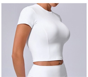 Close-up of white slim fit yoga t-shirt showing elastic sports fabric and side profile