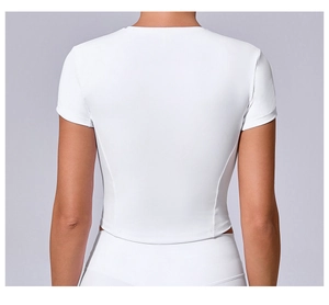 Rear view of a white slim fit yoga top with contouring seam lines and cropped cut