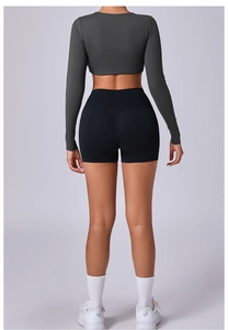 Detailed back view of high-elastic long sleeve yoga top and bodycon fitness shorts