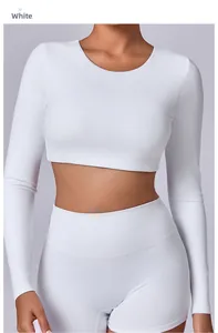 Close-up of white long sleeve yoga top fabric texture and precision tailored stitching