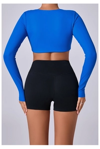 Detail of high-waisted black yoga shorts with V-shaped back seam for butt lifting effect